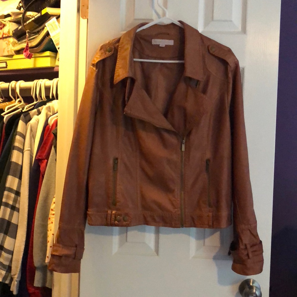 a mid-tone faux leather jacket